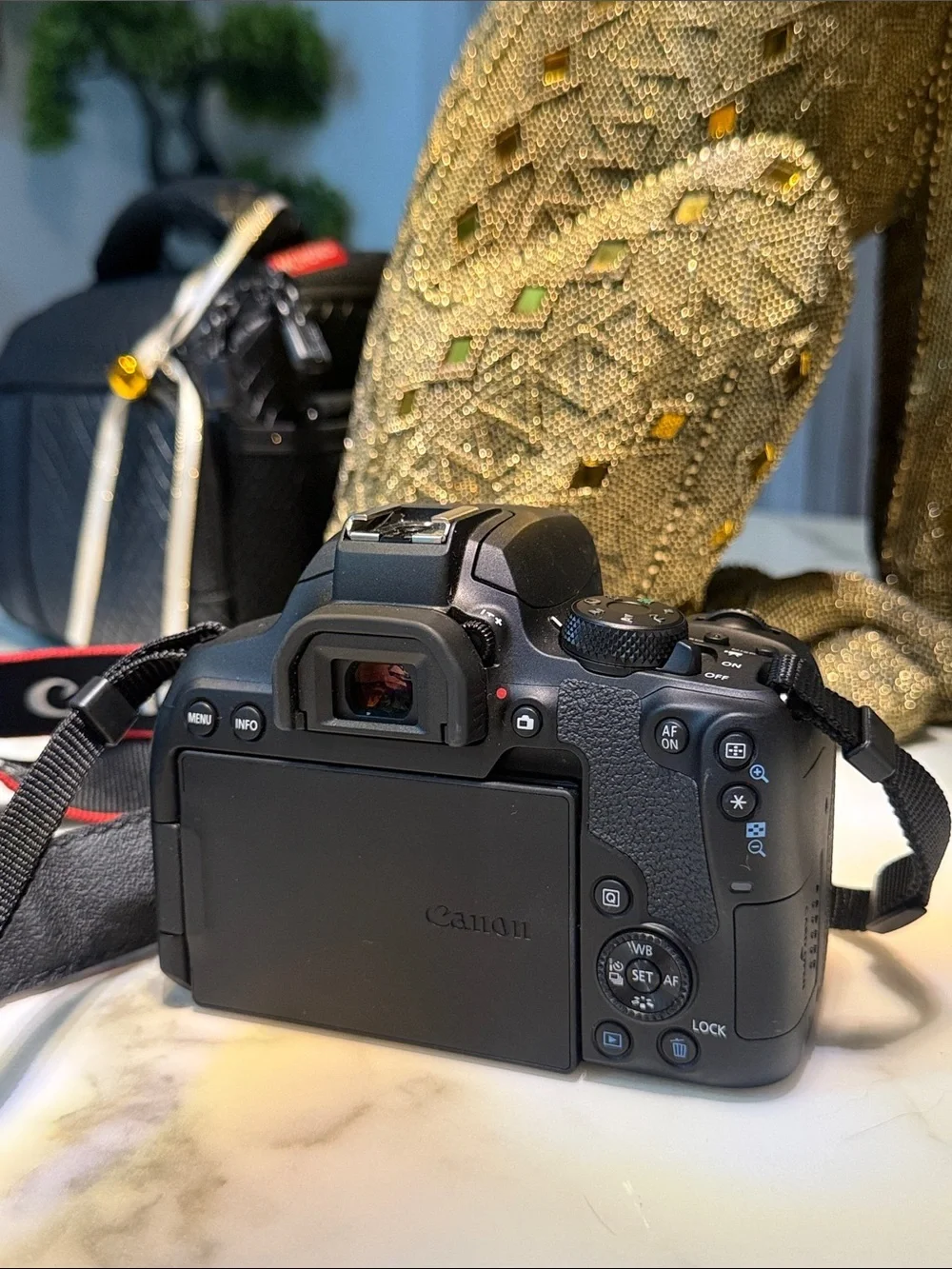 Canon EOS Rebel T8i Camera Kit in Black with Red-Trim Strap